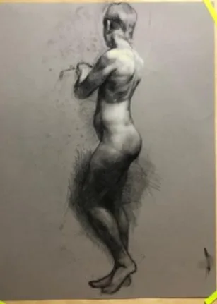 Charcoal and white chalk study of a standing figure on gray paper.