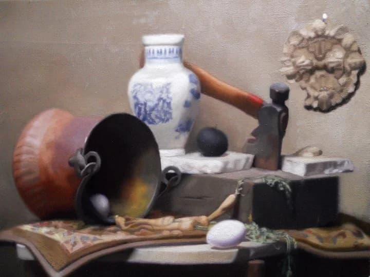 Still life painting: a blue-and-white vase, a copper pan, an egg and a small bronze on a draped table.